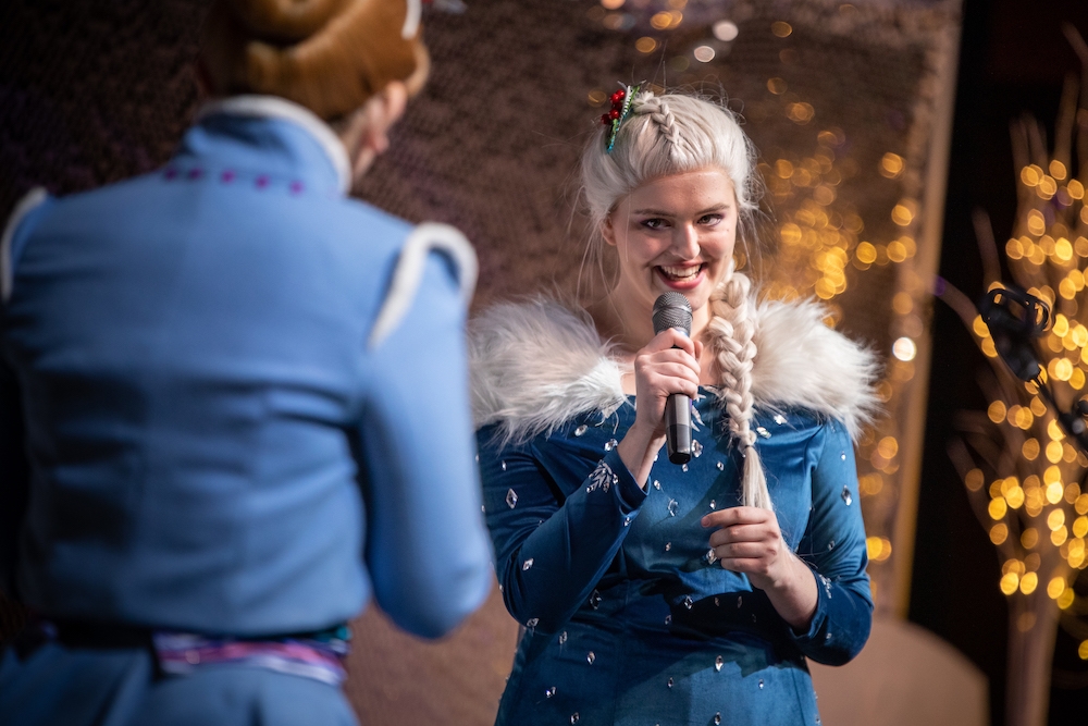 Disney princess performers on stage 